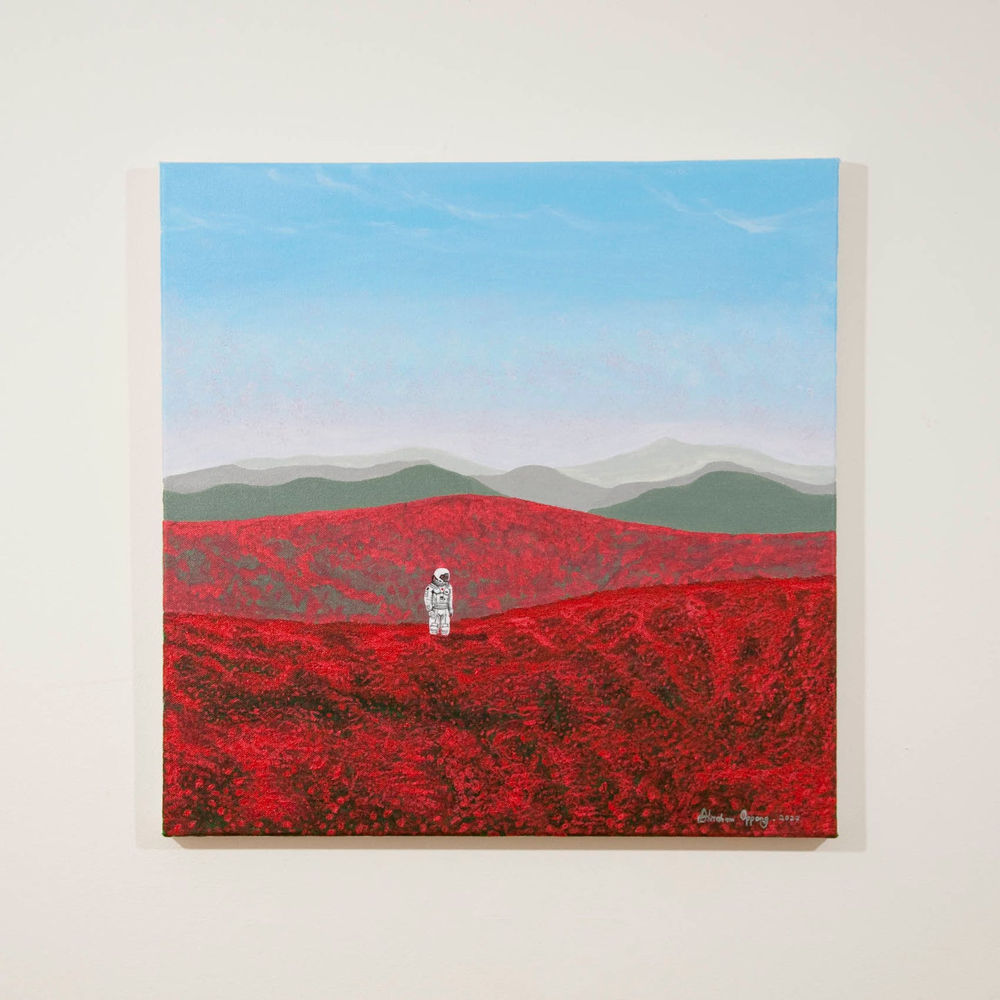 Original semiabstract landscape painting of red fields with an astronaut in white space suit with bluey pink skies and greenish grey hills beyond.